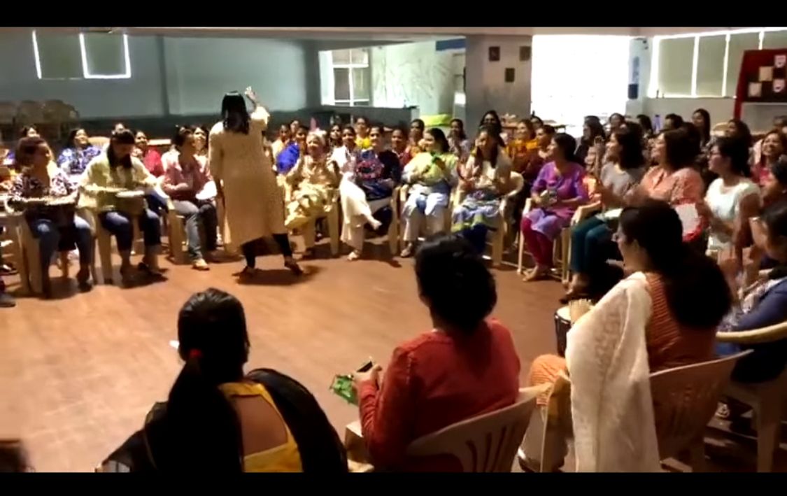 Garima leading an art-based therapy session